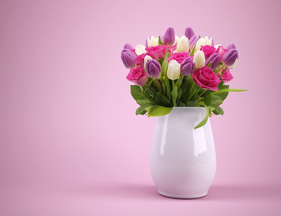 Tulips and roses gathered in a vase